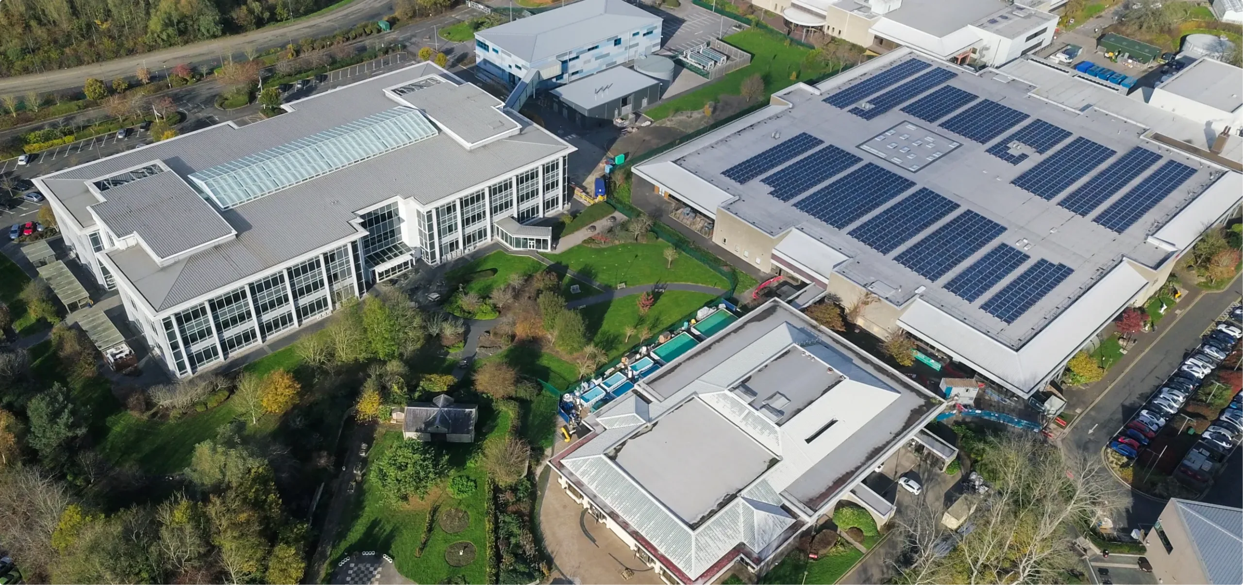 Aerial view of modern buildings with solar panels.